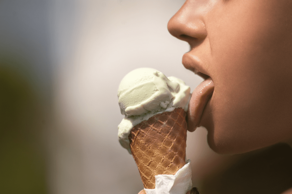 A woman tasting an ice-cream